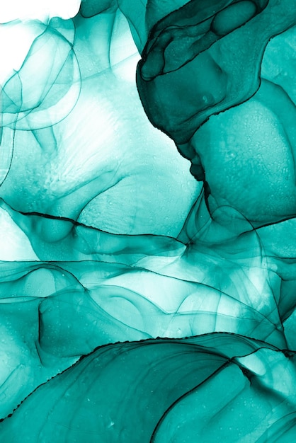 A green and blue background with a drop of water.