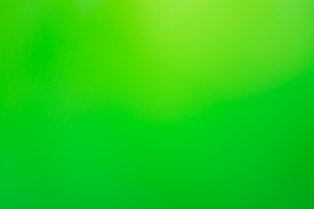 Green blurred colored abstract background Green defocused bokeh background intentionally blurred editing