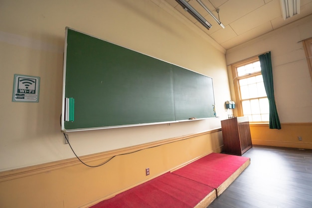 A green board in a classroom with a green board on it