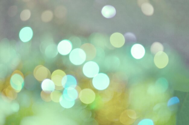 Green bokeh glitter vintage background Abstract green bokeh lights on background