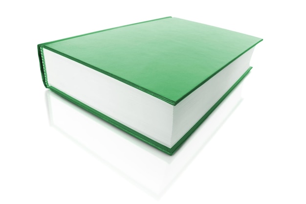 Green book on white background with reflection