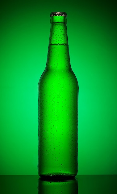 Green bottle of cold beer on green background