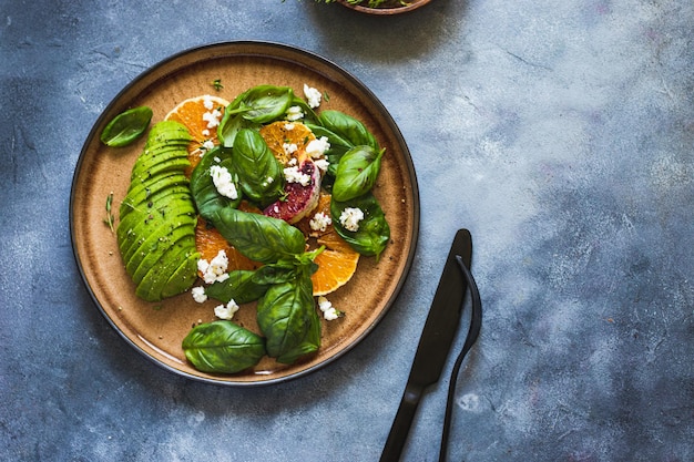 Green bowl salad with blood oranges basil avocado cottage cheese healthy lifestyle concept