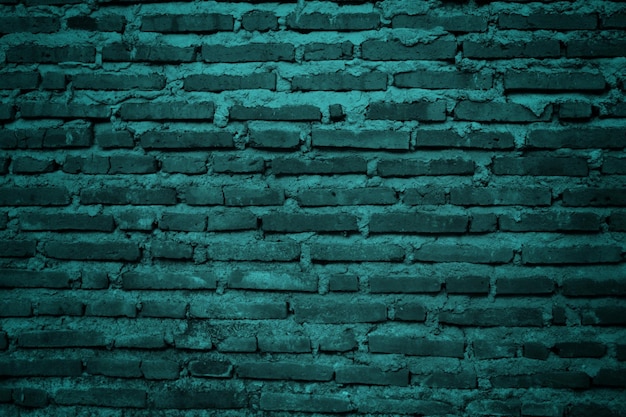 A green brick wall with a dark green brick wall.
