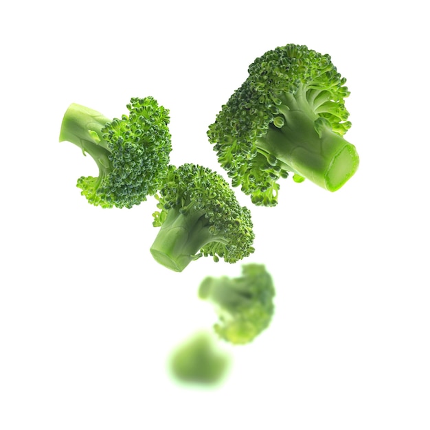 Green broccoli levitating on a white background