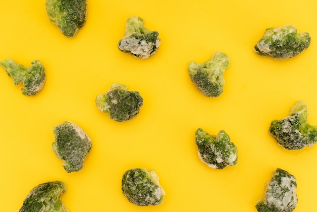 Green broccoli pattern food. Isolated vegetable on white background. Top view.