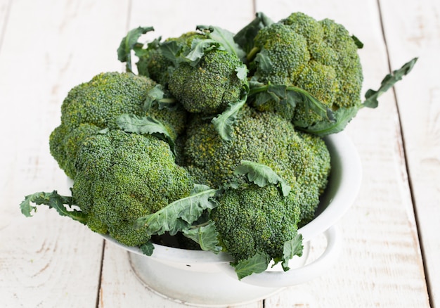 Green broccoli on wood table