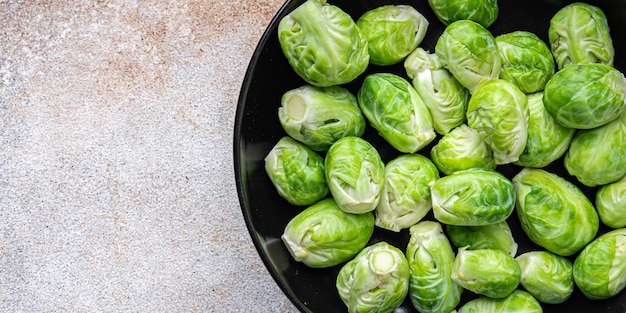 green Brussel sprouts raw vegetable food snack on the table copy space food background top