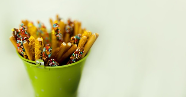 Green bucket with sweets