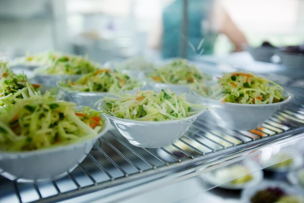 Photo green cabbage salad on a shelf in the dining room food