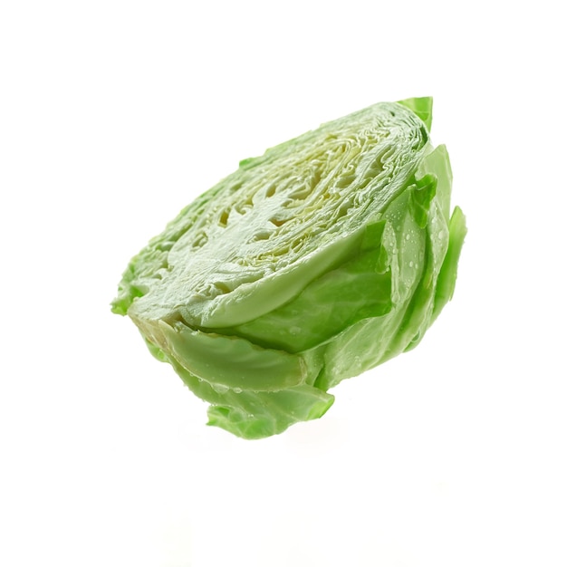 Photo green cabbage on a white background with drops