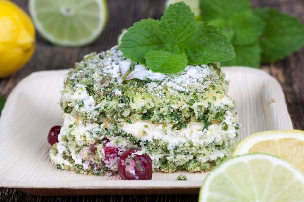 Green cake with cream and lime