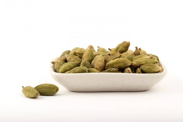 Green Cardamom pods in plate