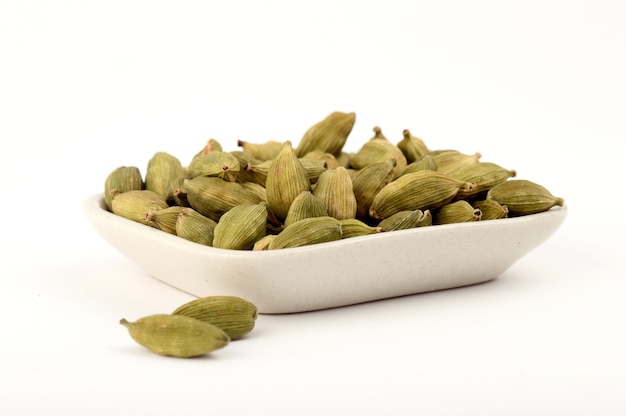 Green Cardamom pods in plate