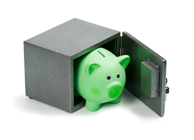 Green ceramic piggy bank in a safe