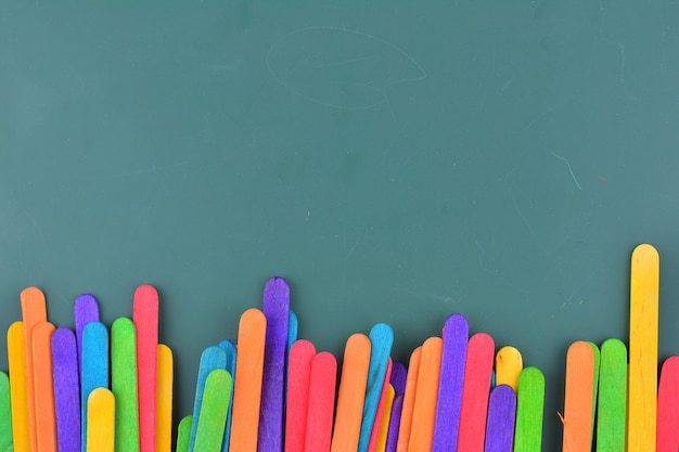 Green chalkboard with colorful ice cream sticks