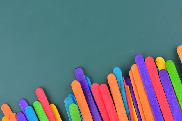 Green chalkboard with colorful ice cream sticks