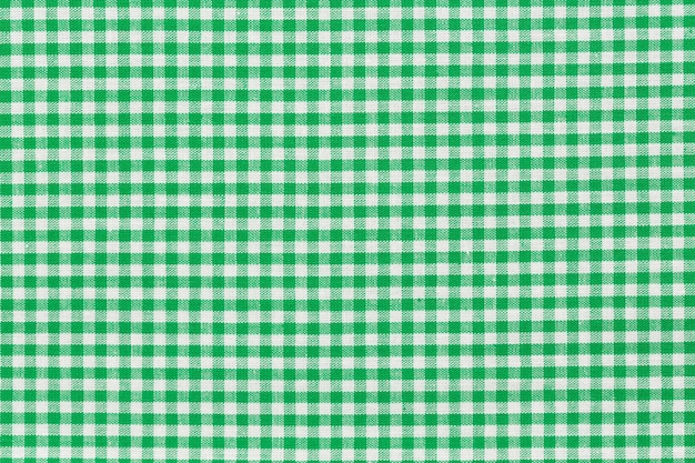 Photo green checkered picnic tablecloth. of high quality