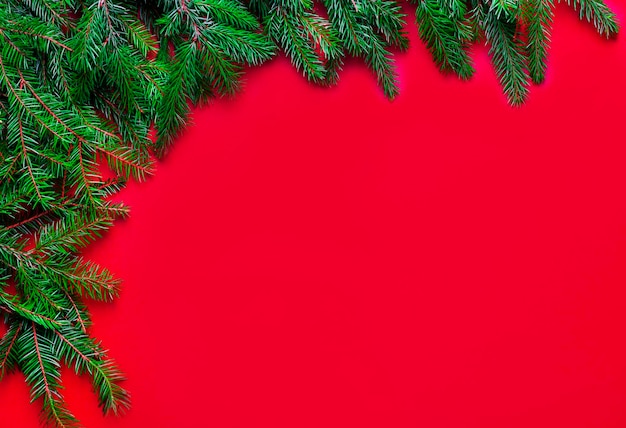 Green Christmas garland of spruce legs on a light wooden background Festive concept with copy space The perfect backdrop for your presentation