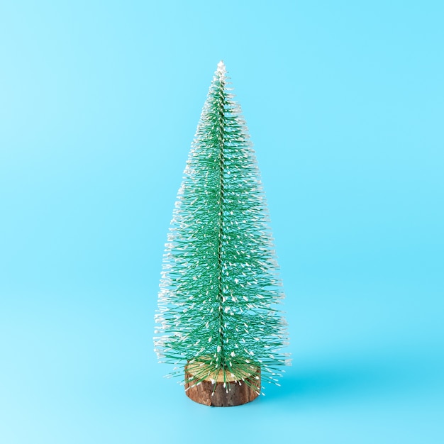 Green Christmas tree on blue