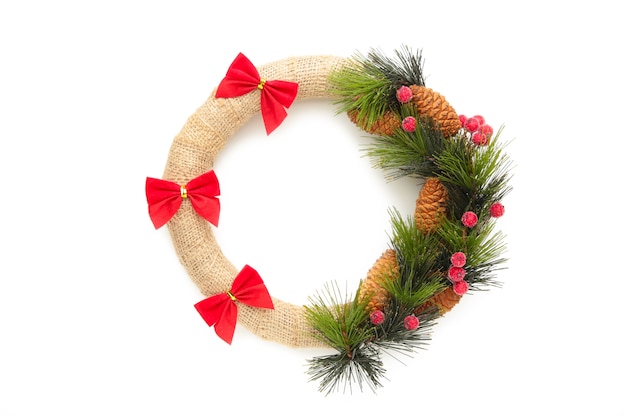 Green christmas wreath decorated with red bow