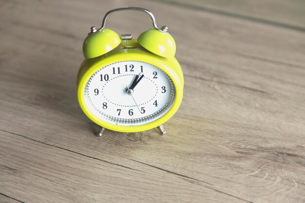 Green clock on the table