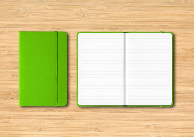 Green closed and open lined notebooks