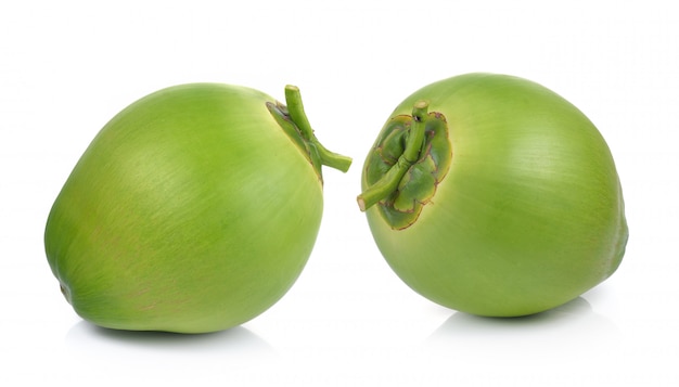 Green coconuts on white background