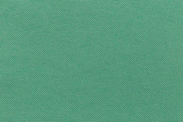 Текстура полиэстера ткани зеленого цвета и текстильный фон