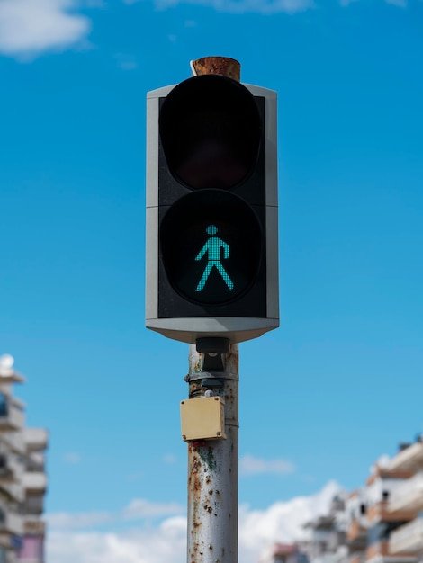 Green color on the traffic light with a beautiful blue sky