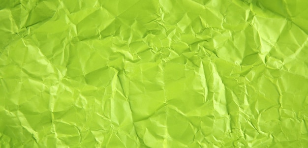 Photo green crumpled background or texture.