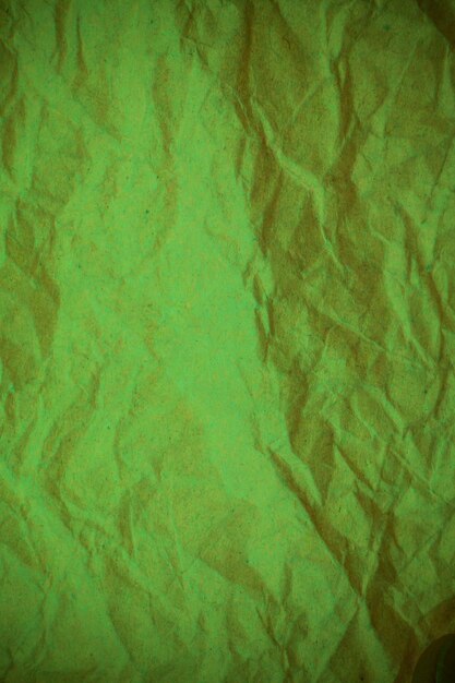 Photo green crumpled paper background.