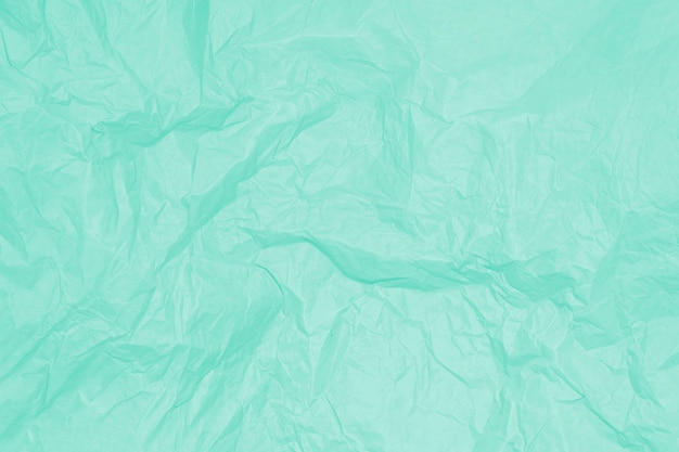 Green crumpled sheet of paper