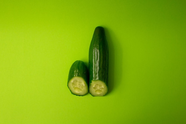 Green cucumber on a green background