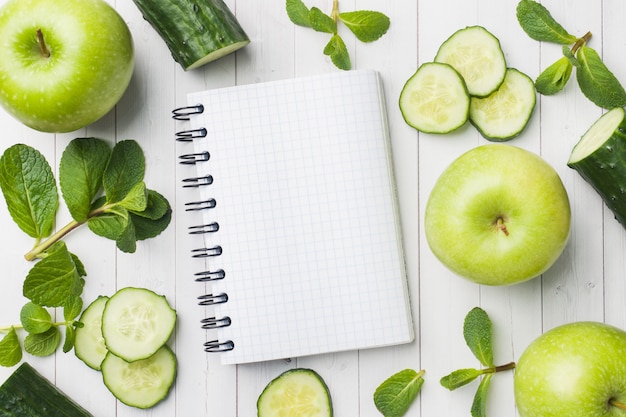 Green cucumber mint Apple on the table. 