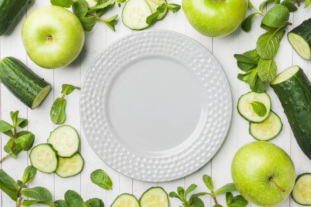 Green cucumber mint Apple on the table.