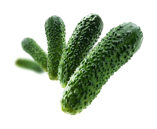 Photo green cucumbers levitate on a white background