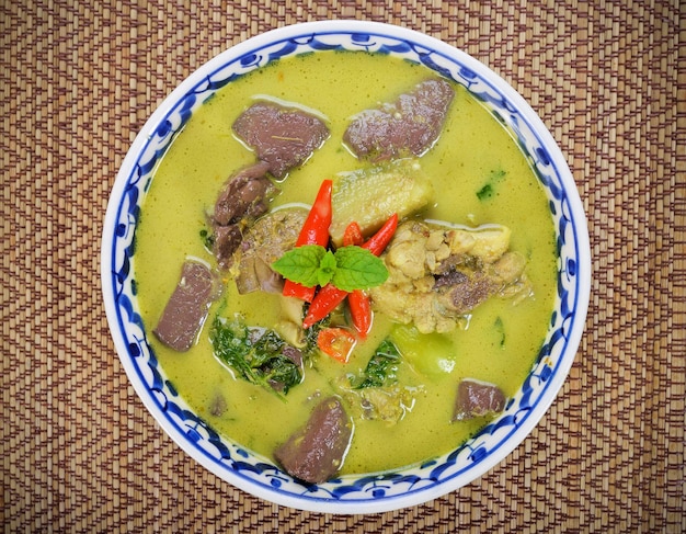 Green Curry With Chicken on wood table