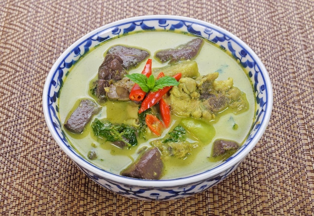 Green Curry With Chicken on wood table