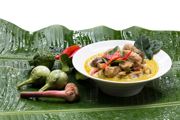 Green Curry with Fresh Fish Balls on dish with banana leaf.