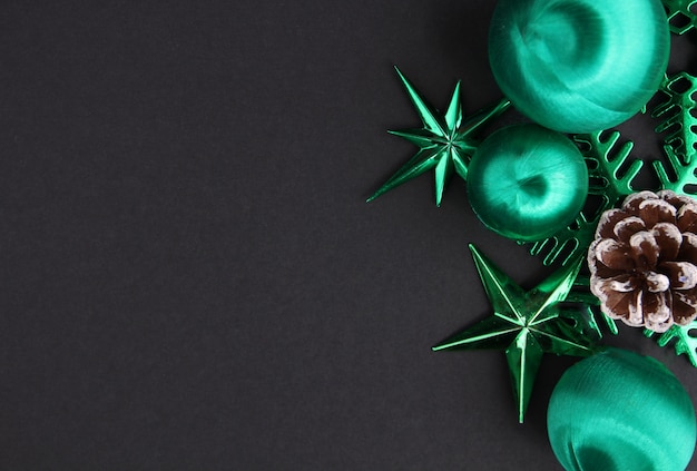 A green decoration for a Christmas day with a black backdrop.