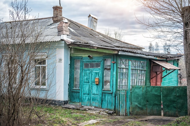 Green door in an old residential building in the town of Bolokhovo