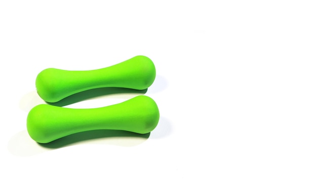 Green dumbbells on white backgrounds