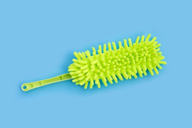 Photo green duster on blue background