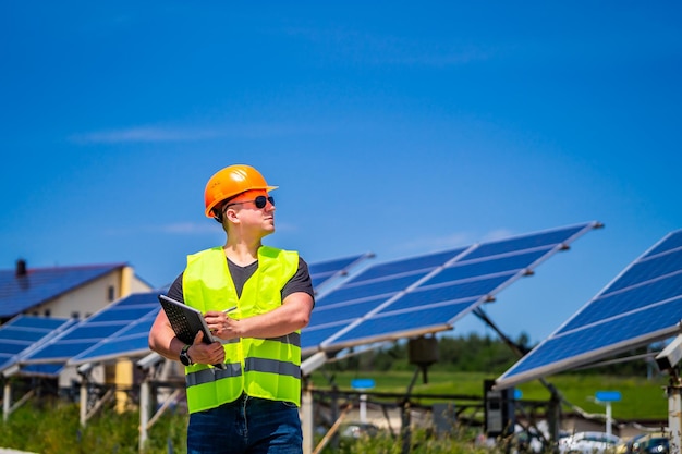 Green energy worker is conducting onsite inspection visit at\
the new energy base