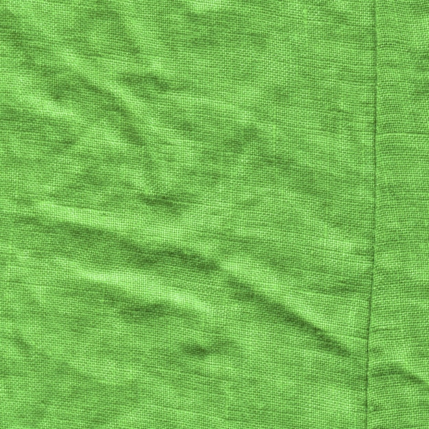 Green fabric surface for background Green linen texture Green flaxen background