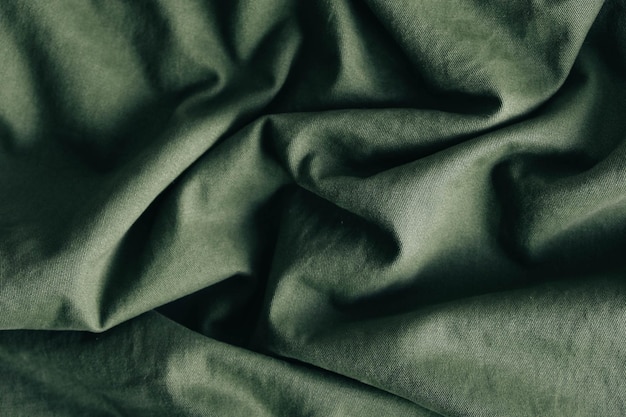 Photo green fabric texture as background image. top view. copy, empty space for text