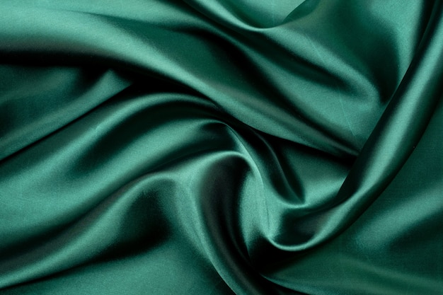 Green fabric texture background, abstract, closeup texture of cloth