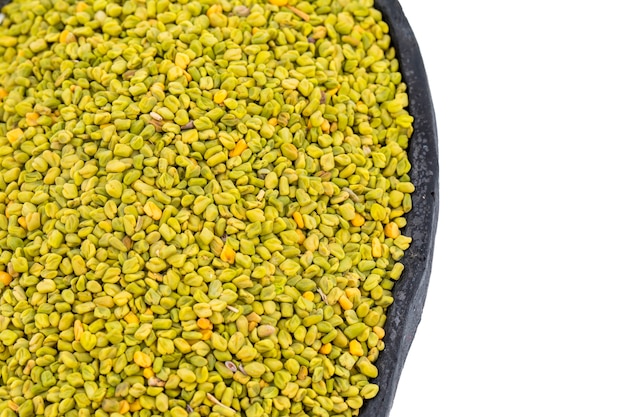 Green Fenugreek Seeds on White Background