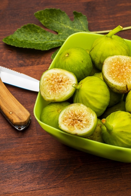 Green figs, fresh and ripe. With a fig leaf.